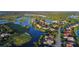 Aerial view of Waterlefe Golf & River Club, showcasing houses and waterways at 9606 Sea Turtle Ter # 101, Bradenton, FL 34212