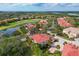 Community overview featuring houses and golf course at 9606 Sea Turtle Ter # 101, Bradenton, FL 34212