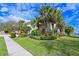 Exterior view of home with lush landscaping at 9606 Sea Turtle Ter # 101, Bradenton, FL 34212