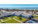 Aerial view of beachside property, showing building and ocean at 100 The Esplanade N # 1, Venice, FL 34285