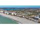 Wide aerial view of coastline, beach, and town at 100 The Esplanade N # 1, Venice, FL 34285