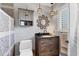 Updated bathroom with a walk-in shower and stylish vanity at 100 The Esplanade N # 1, Venice, FL 34285