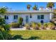 Charming bungalow-style home with a well-manicured lawn at 100 The Esplanade N # 1, Venice, FL 34285