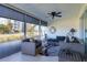 Screened lanai with comfortable seating and outdoor views at 100 The Esplanade N # 1, Venice, FL 34285