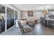 Open concept living and dining area with coastal decor at 100 The Esplanade N # 1, Venice, FL 34285
