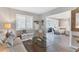 Open concept living room and adjacent sitting area at 100 The Esplanade N # 1, Venice, FL 34285