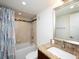 Bathroom with tub shower combo, granite vanity, and updated features at 101 S Gulfstream Ave # 10E, Sarasota, FL 34236