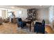 Community room featuring a game table, bookshelves, and seating at 101 S Gulfstream Ave # 10E, Sarasota, FL 34236