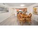Dining area with wood table and wicker chairs, open to kitchen at 101 S Gulfstream Ave # 10E, Sarasota, FL 34236