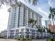 Modern high-rise building with numerous balconies and ground floor retail at 101 S Gulfstream Ave # 10E, Sarasota, FL 34236