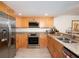 Modern kitchen with stainless steel appliances and light wood cabinets at 101 S Gulfstream Ave # 10E, Sarasota, FL 34236