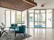 Bright lobby with seating area and glass doors leading outside at 101 S Gulfstream Ave # 10E, Sarasota, FL 34236