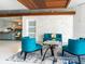 Elegant lobby with comfortable teal seating and a stylish glass coffee table at 101 S Gulfstream Ave # 10E, Sarasota, FL 34236