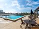Inviting rooftop pool with ample seating and umbrellas at 101 S Gulfstream Ave # 10E, Sarasota, FL 34236