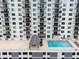 Communal rooftop pool with lounge area at 101 S Gulfstream Ave # 10E, Sarasota, FL 34236