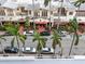 Street view of shops and palm trees from condo balcony at 101 S Gulfstream Ave # 10E, Sarasota, FL 34236