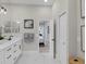 Elegant bathroom with double vanity, marble flooring, and access to bedroom at 10114 Glenmore Ave, Bradenton, FL 34202