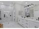 Spa-like bathroom with double vanity, marble shower, and modern lighting at 10114 Glenmore Ave, Bradenton, FL 34202
