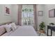 Light and airy bedroom with a queen bed, and neutral decor at 10114 Glenmore Ave, Bradenton, FL 34202