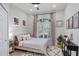 Guest bedroom with queen bed, neutral tones and plenty of natural light at 10114 Glenmore Ave, Bradenton, FL 34202