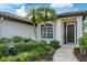 Well-maintained front yard with palm trees and a stone pathway at 10114 Glenmore Ave, Bradenton, FL 34202