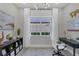 Bright home office with a window, desk, and chair at 10114 Glenmore Ave, Bradenton, FL 34202
