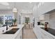 Modern kitchen with white cabinets, breakfast bar, and stainless steel appliances at 10114 Glenmore Ave, Bradenton, FL 34202