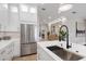 Modern kitchen with white cabinets, a large island, and stainless steel appliances at 10114 Glenmore Ave, Bradenton, FL 34202