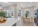 Modern kitchen with breakfast nook, white cabinets, and pool view at 10114 Glenmore Ave, Bradenton, FL 34202