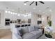 Open concept kitchen and living area, featuring modern white cabinets, a large island, and comfortable seating at 10114 Glenmore Ave, Bradenton, FL 34202