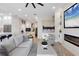 Bright living room with a fireplace, large TV, comfortable seating, and stylish decor at 10114 Glenmore Ave, Bradenton, FL 34202