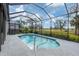 Screened-in pool with a view of the golf course at 10114 Glenmore Ave, Bradenton, FL 34202