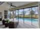 Relaxing pool area with wicker furniture and golf course view at 10114 Glenmore Ave, Bradenton, FL 34202