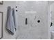 Spa-like shower with marble tile, glass enclosure, and built-in shelving at 10114 Glenmore Ave, Bradenton, FL 34202