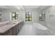 Luxurious bathroom with double vanity, soaking tub, and glass shower at 11323 Rivers Bluff Cir, Lakewood Ranch, FL 34202