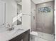 Clean bathroom with a walk in shower, toilet and vanity at 11323 Rivers Bluff Cir, Lakewood Ranch, FL 34202