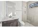 Modern bathroom with a glass shower and dark vanity at 11323 Rivers Bluff Cir, Lakewood Ranch, FL 34202