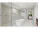 Spa-like bathroom with a soaking tub and walk-in shower at 11323 Rivers Bluff Cir, Lakewood Ranch, FL 34202