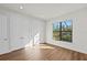 Bright bedroom with hardwood floors and large window at 11323 Rivers Bluff Cir, Lakewood Ranch, FL 34202