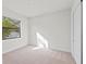 Spacious bedroom with neutral carpeting and large window at 11323 Rivers Bluff Cir, Lakewood Ranch, FL 34202