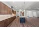 Modern kitchen features wood cabinets, quartz countertops, and a large island at 11323 Rivers Bluff Cir, Lakewood Ranch, FL 34202
