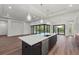 Modern kitchen with island, stainless steel appliances, and wood cabinets at 11323 Rivers Bluff Cir, Lakewood Ranch, FL 34202