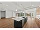 Modern kitchen with island, stainless steel appliances, and wood cabinets at 11323 Rivers Bluff Cir, Lakewood Ranch, FL 34202
