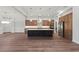 Modern kitchen with island, stainless steel appliances, and wood cabinets at 11323 Rivers Bluff Cir, Lakewood Ranch, FL 34202