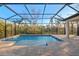 Enclosed pool area with a screened patio at 11323 Rivers Bluff Cir, Lakewood Ranch, FL 34202