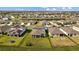 Two-story house, blue exterior, screened patio, backyard view at 11628 Middle Fork Way, Parrish, FL 34219