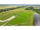 Aerial view of community features including a dog park and pond at 11628 Middle Fork Way, Parrish, FL 34219