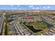 Aerial view of a house in a residential community near a lake at 11628 Middle Fork Way, Parrish, FL 34219
