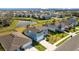 Two-story house, blue exterior, solar panels, front yard view at 11628 Middle Fork Way, Parrish, FL 34219