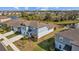 Two-story house, blue exterior, solar panels, side yard view at 11628 Middle Fork Way, Parrish, FL 34219